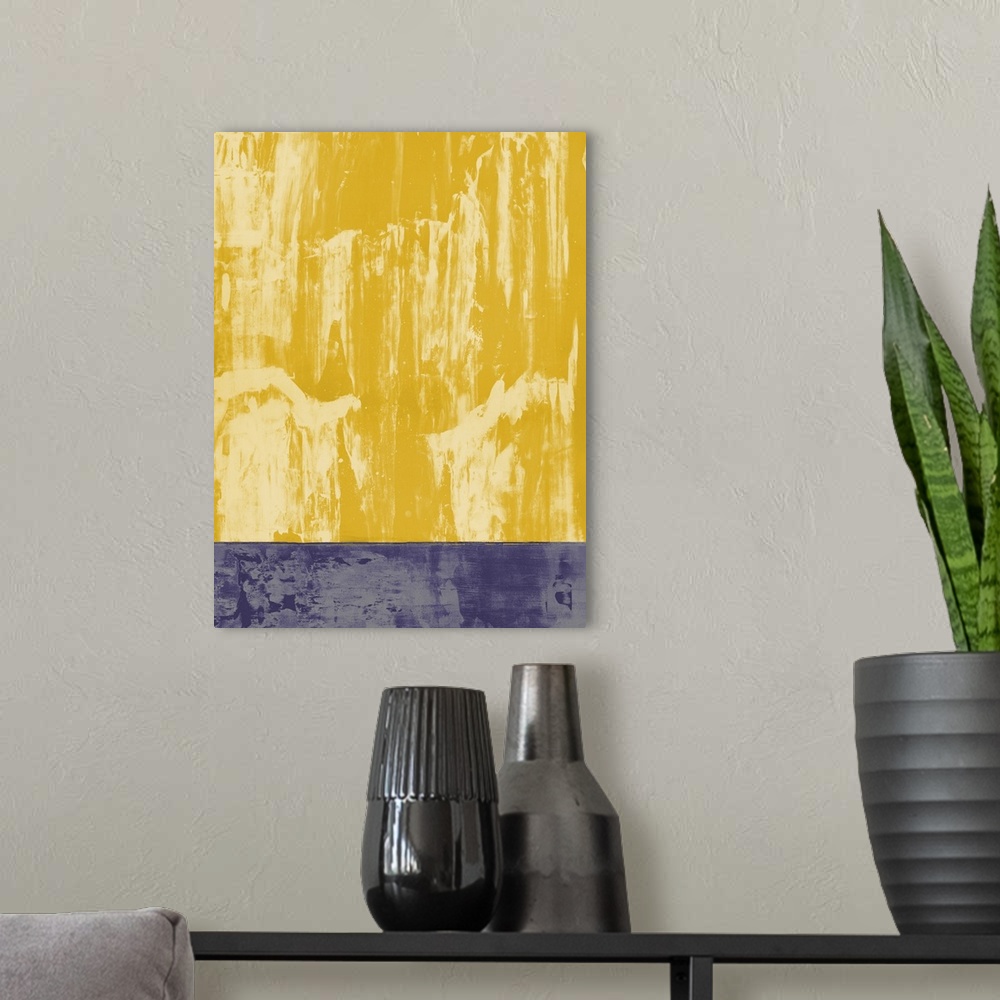 A modern room featuring Large abstract painting in shades of yellow and purple split into two sections.