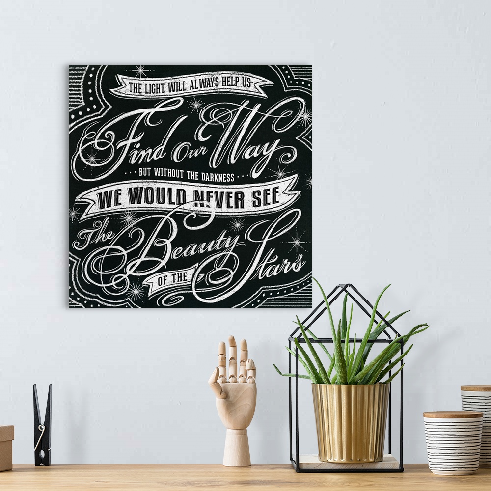 A bohemian room featuring Typography artwork in a chalkboard style reading "The light will always help us find our way but ...