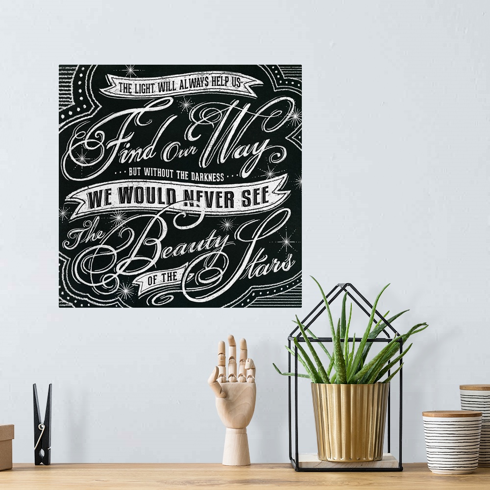 A bohemian room featuring Typography artwork in a chalkboard style reading "The light will always help us find our way but ...