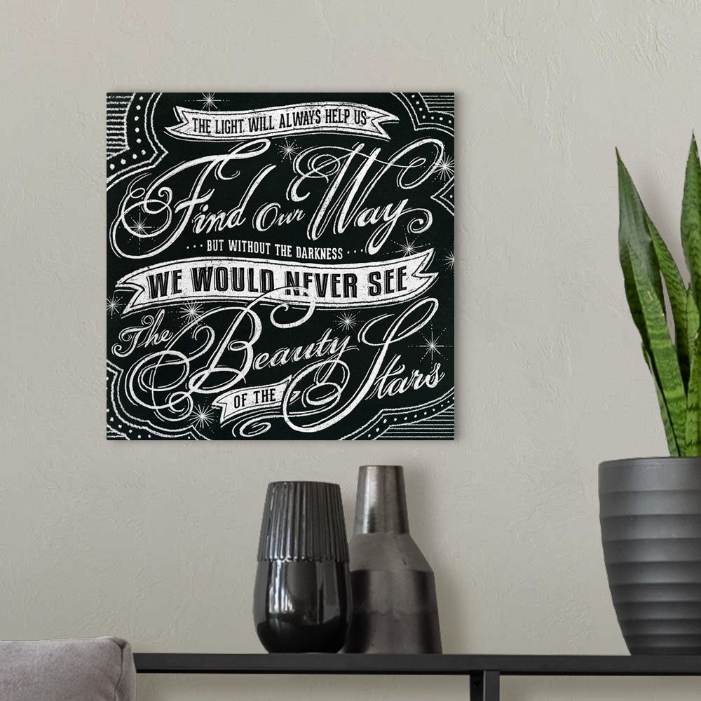 A modern room featuring Typography artwork in a chalkboard style reading "The light will always help us find our way but ...
