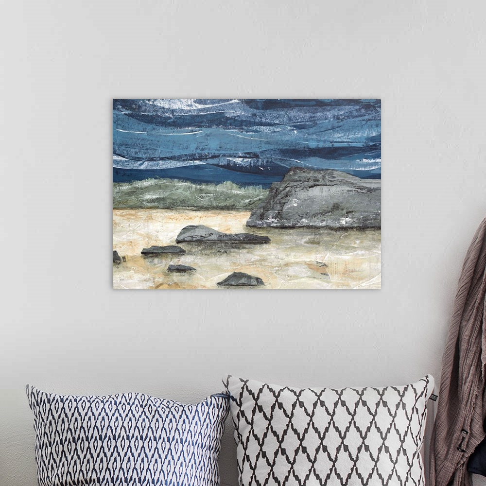 A bohemian room featuring Abstract landscape painting with a rocky ground and a wavy blue sky.