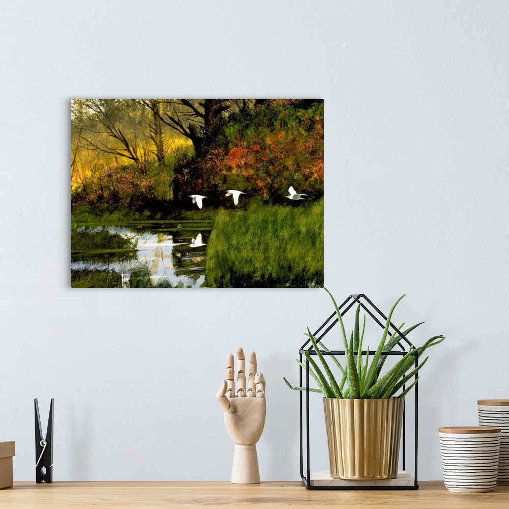 A bohemian room featuring Contemporary painting of three egrets flying over lush wetlands.