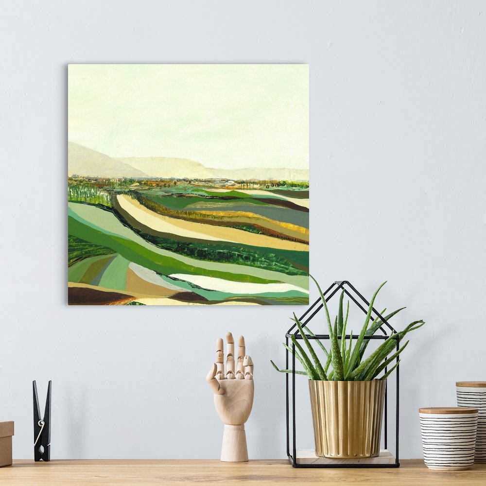 A bohemian room featuring Contemporary abstract painting resembling a green landscape.