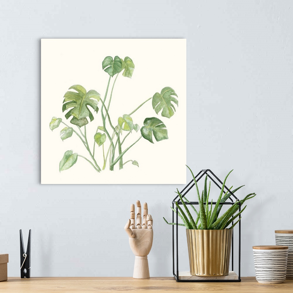 A bohemian room featuring Square watercolor painting of tropical leaves on an off white background.