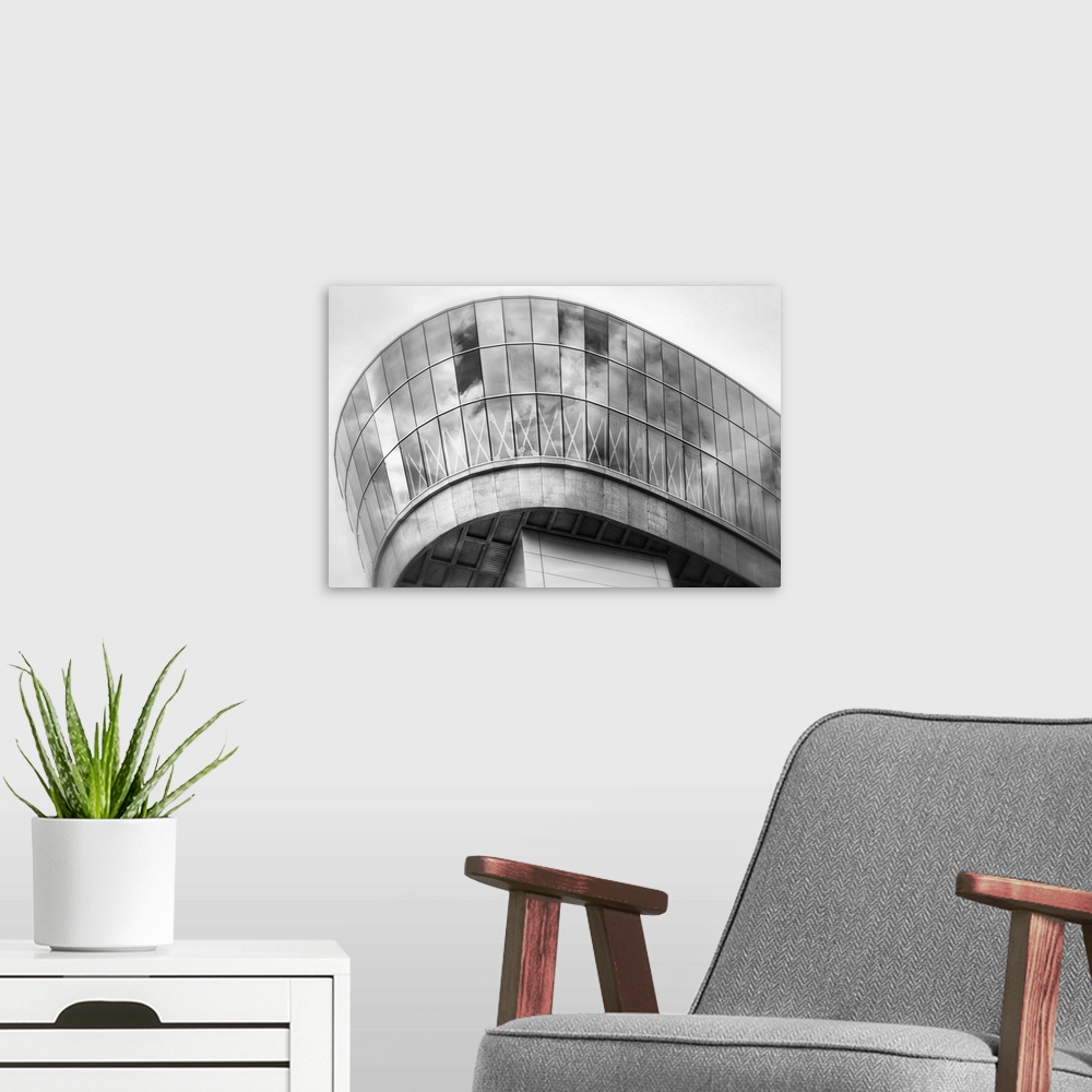 A modern room featuring A fine art photograph of modern architectural attributes.