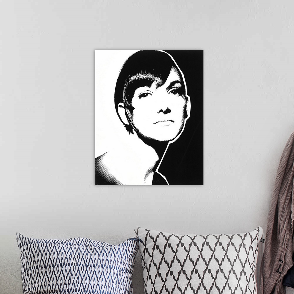 A bohemian room featuring Black and white illustration of a woman with short hair.