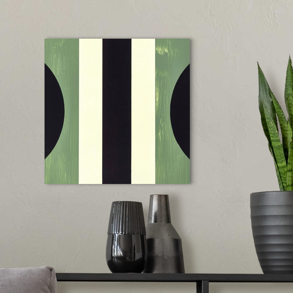 A modern room featuring Square symmetric abstract painting using geometric shapes in shades of green, black, and cream.