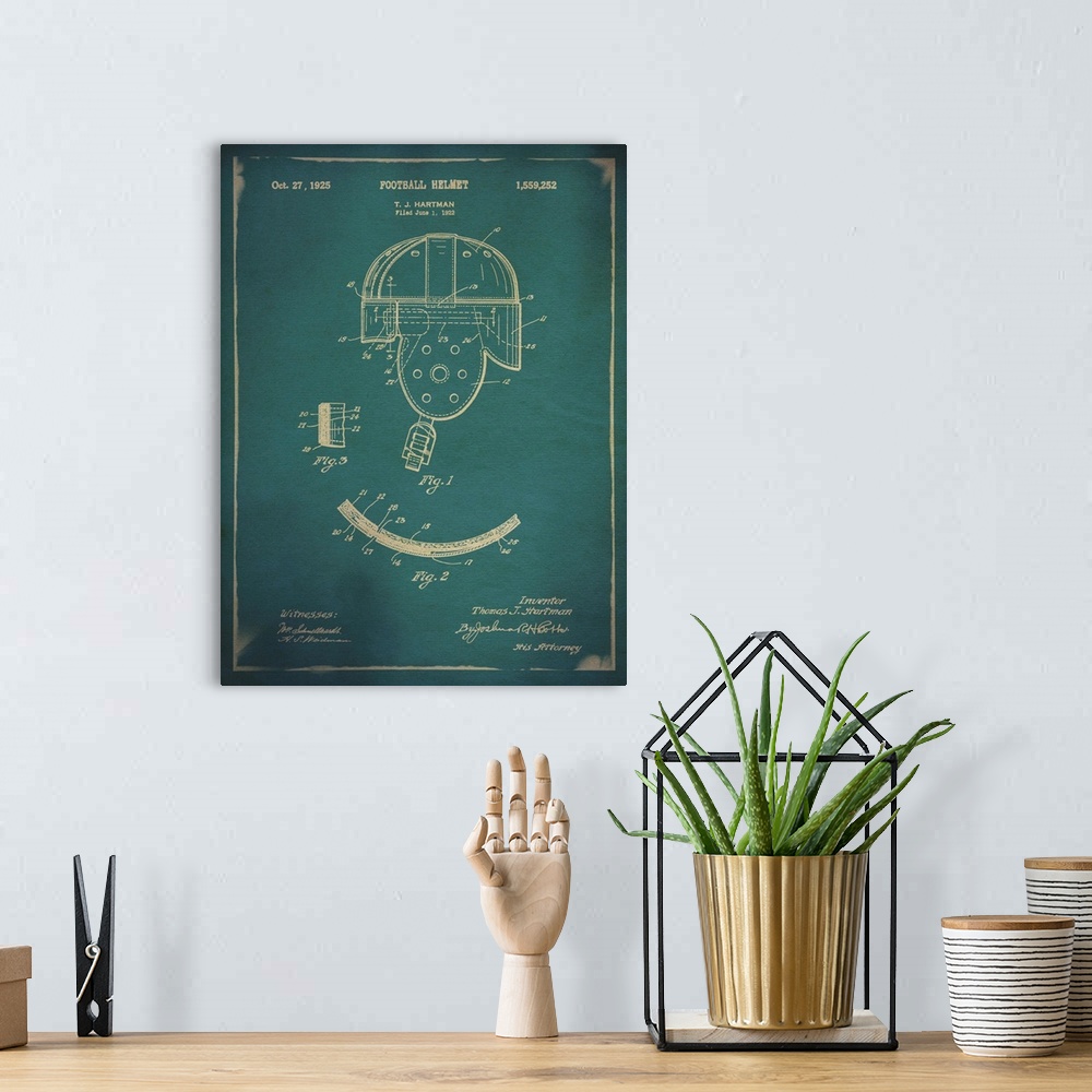 A bohemian room featuring Blueprint diagram depicting the parts of a vintage football helmet.