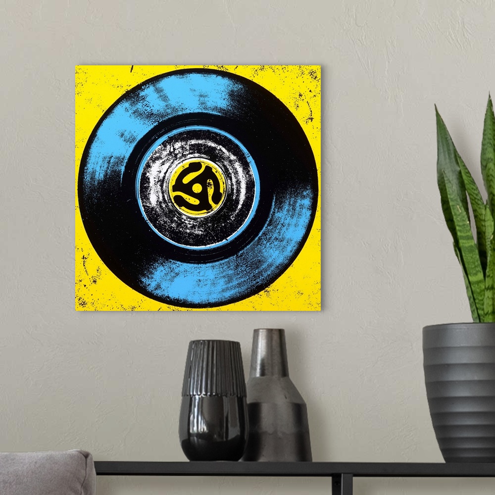 A modern room featuring Contemporary pop art style artwork of a vinyl against a yellow background.