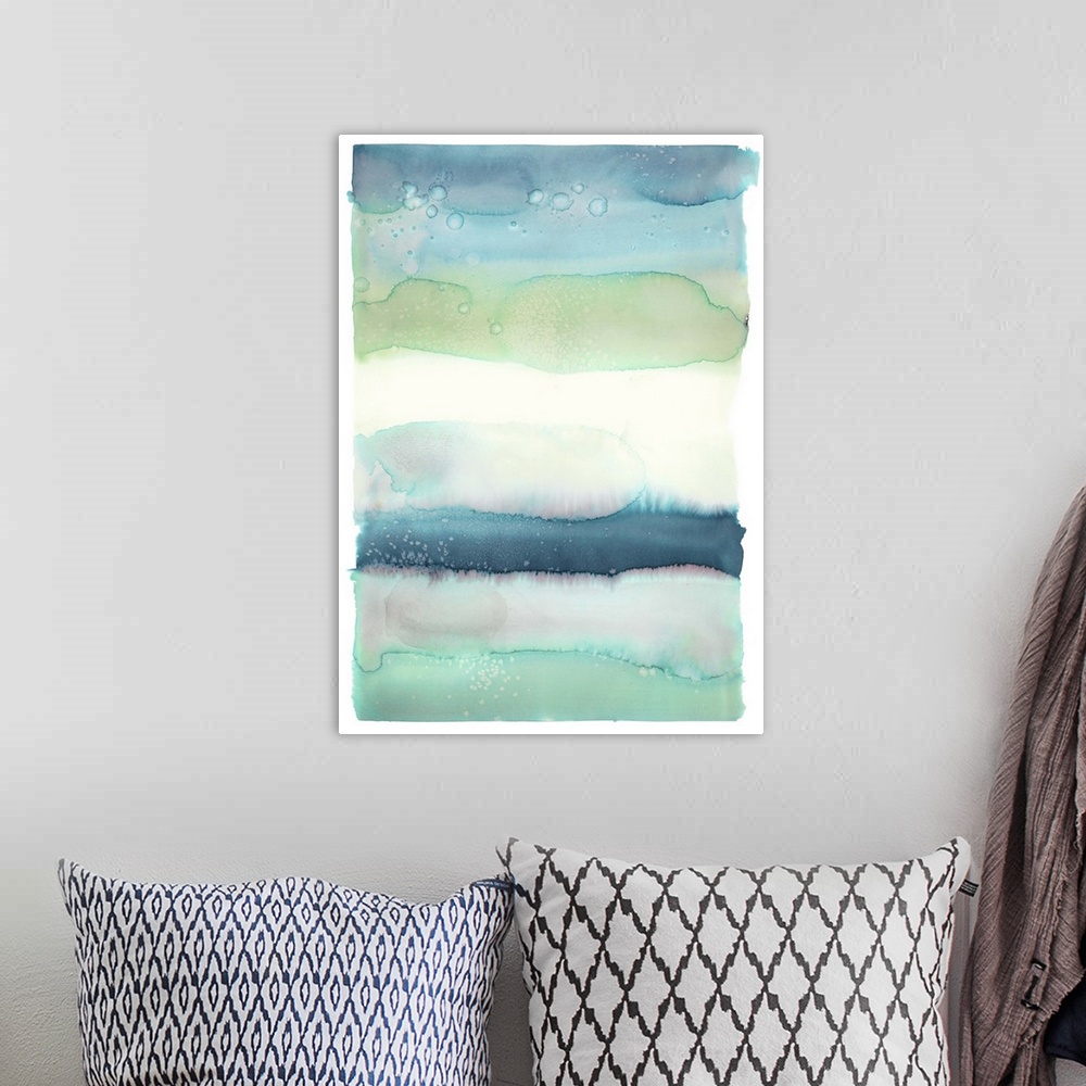 A bohemian room featuring Blue, green, and white watercolor painting in horizontal layers.
