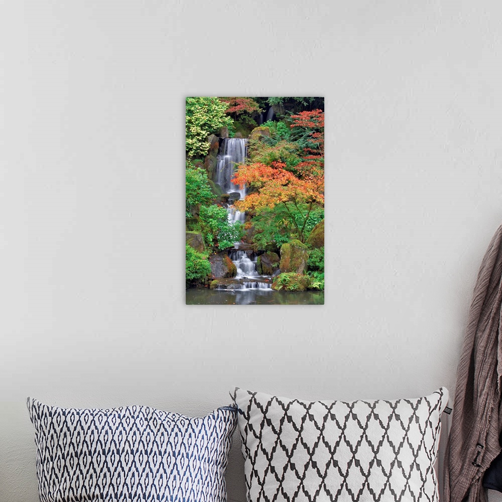 A bohemian room featuring Photograph of waterfall surrounded by autumn trees.