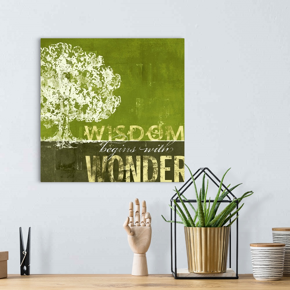 A bohemian room featuring A motivational poster with a sponge like painting of a large oak tree with earthy tones as the sk...