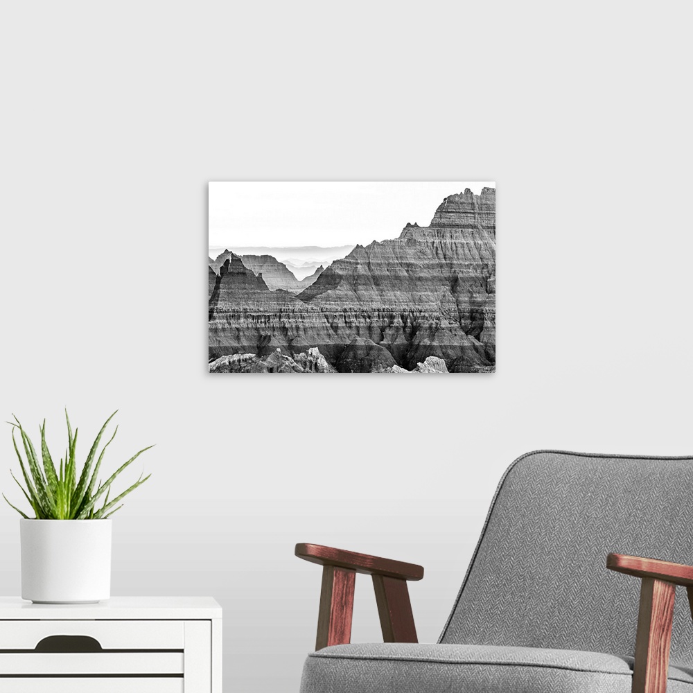 A modern room featuring The wonderful layers of South Dakota's Badlands National Park fade into the distant haze. This go...