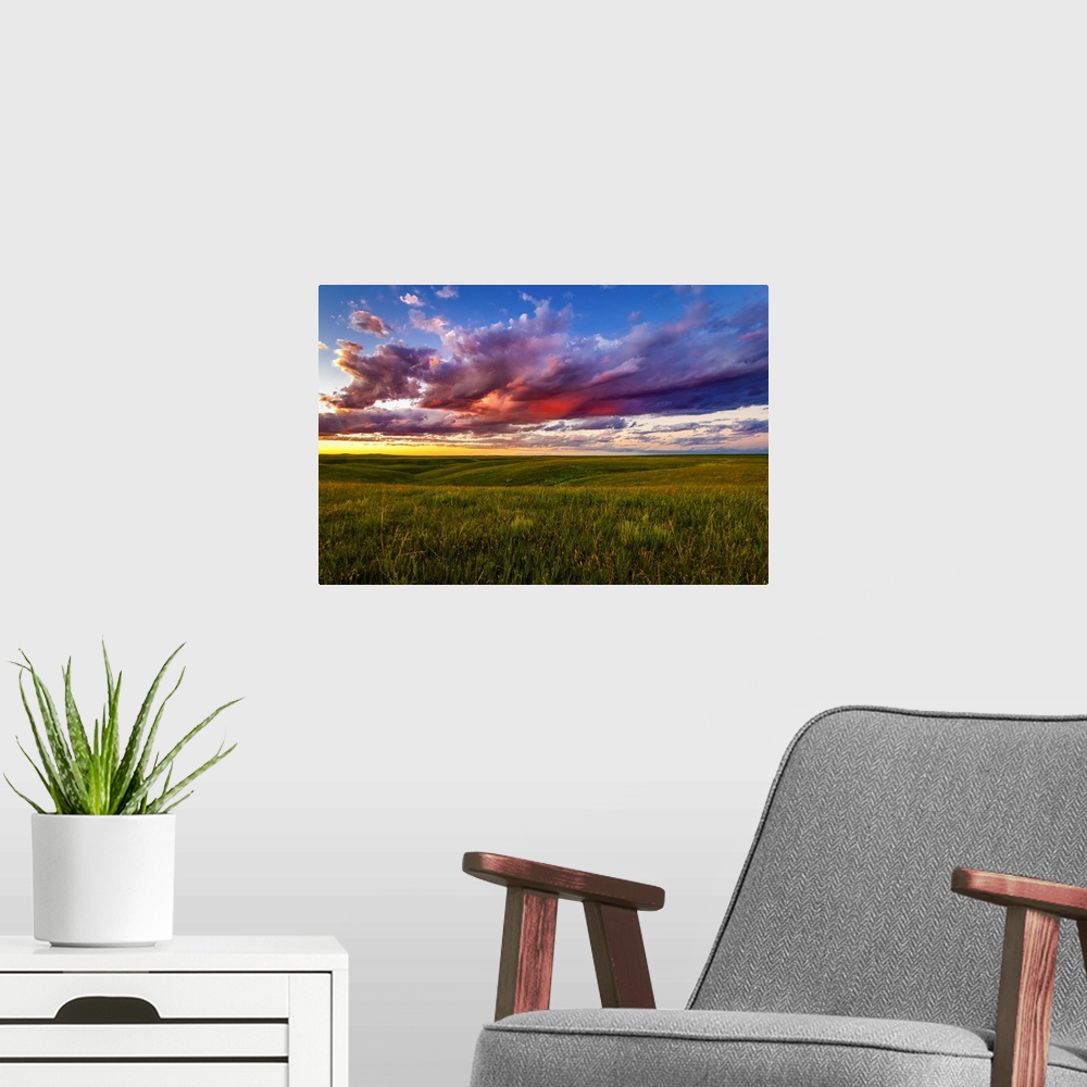 A modern room featuring The setting casts beautiful colors into the clouds over the plains near Pierre, South Dakota. Tim...