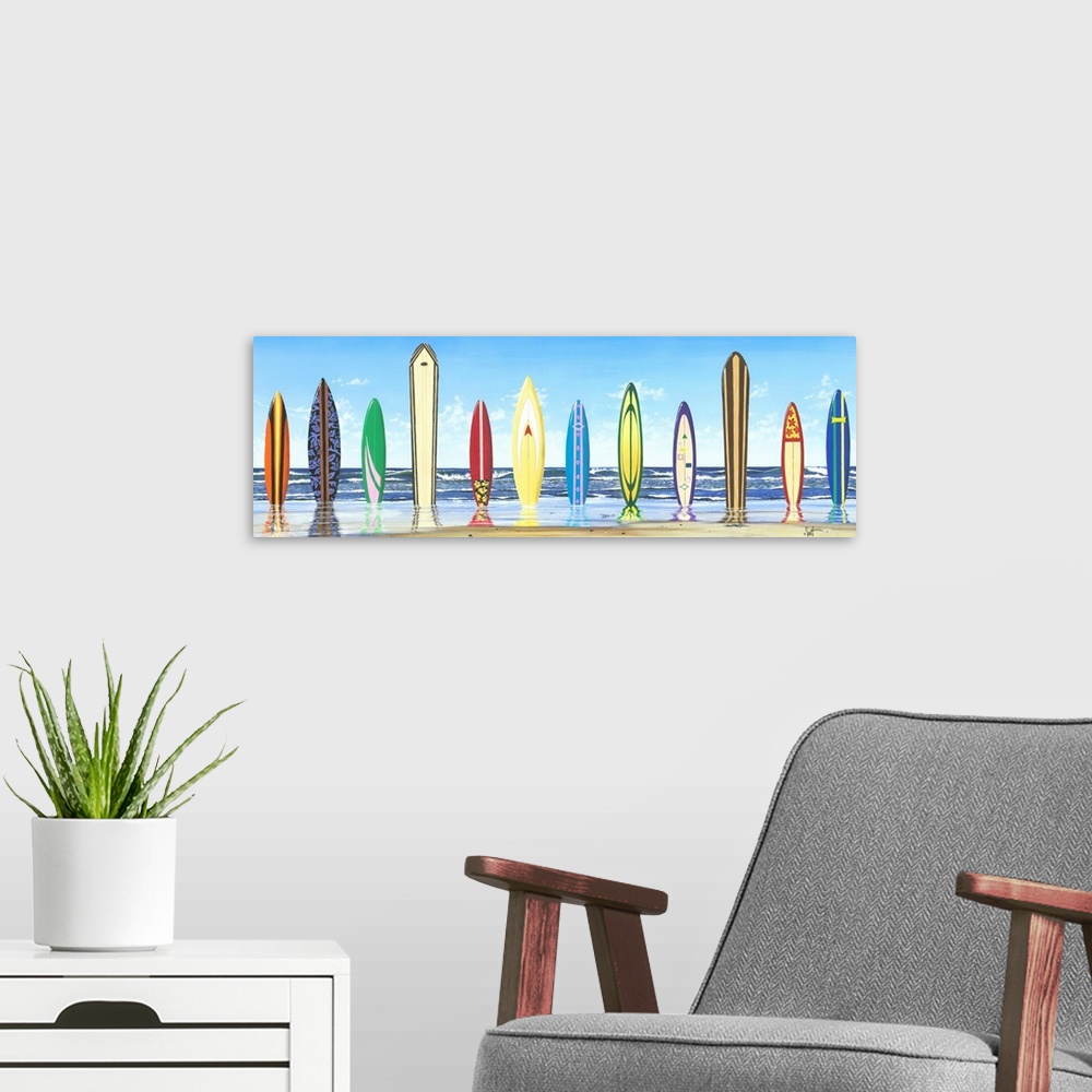 A modern room featuring Panoramic photograph of color surfboards standing in sand with the ocean in the background.