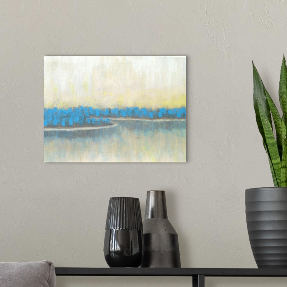 A modern room featuring Abstract landscape painting of a lake lined with blue trees.