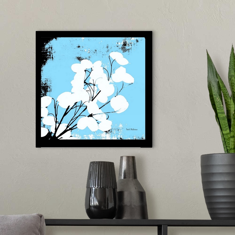 A modern room featuring Square silhouetted painting of a money plant in black, white, and light blue.