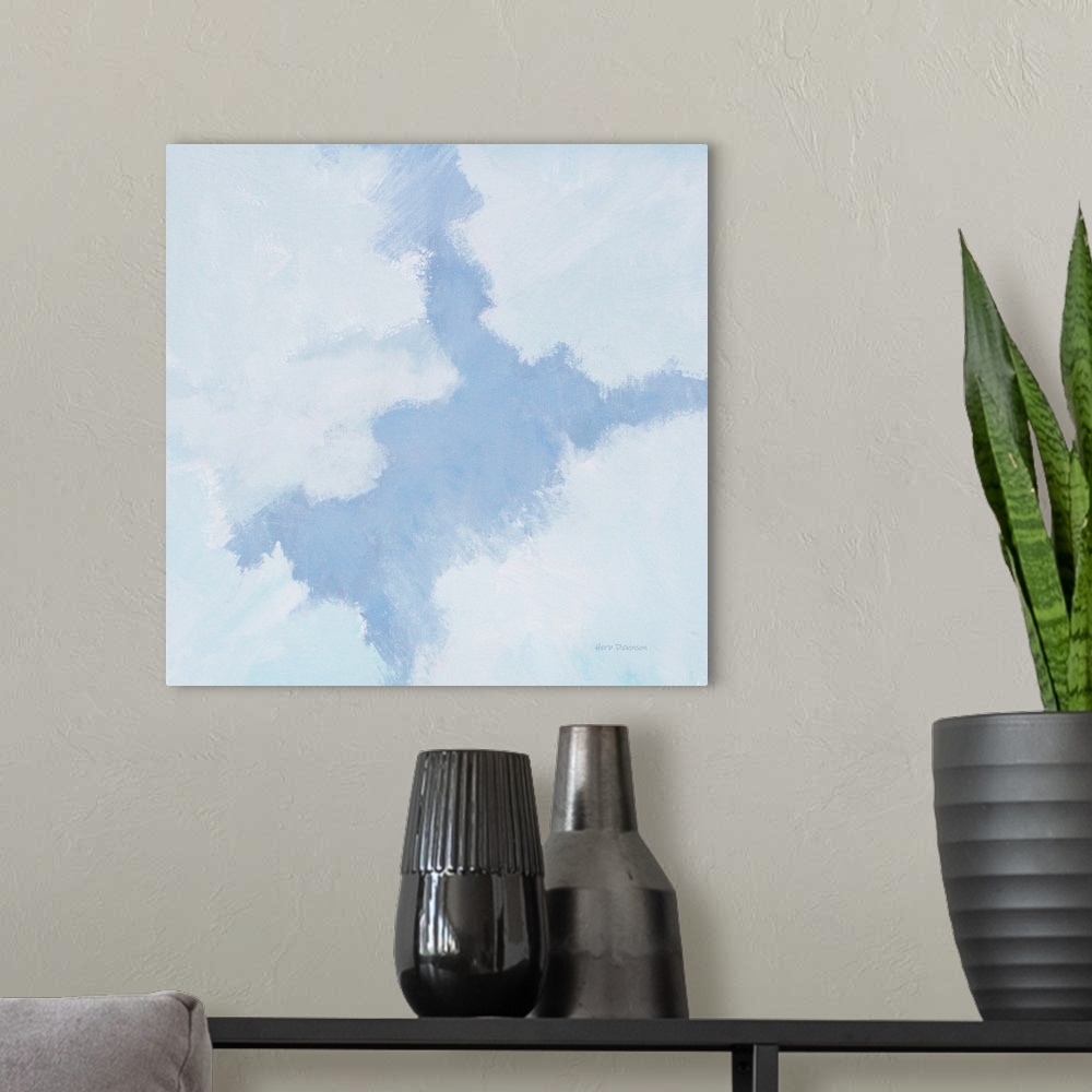 A modern room featuring Square painting of a cloudscape in shades of blue, gray, and white.