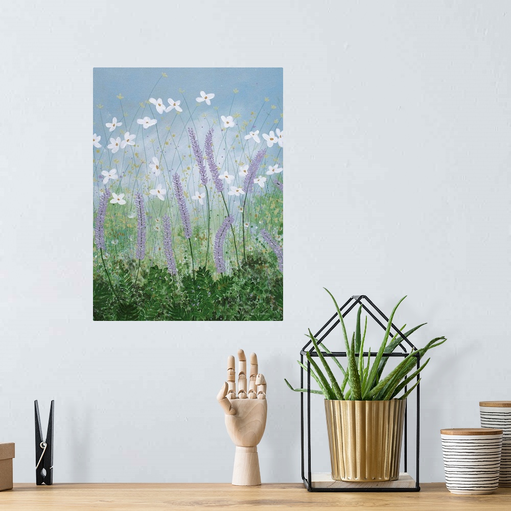 A bohemian room featuring Contemporary painting of purple, white, and yellow wildflowers in a grassy field with a dusty blu...