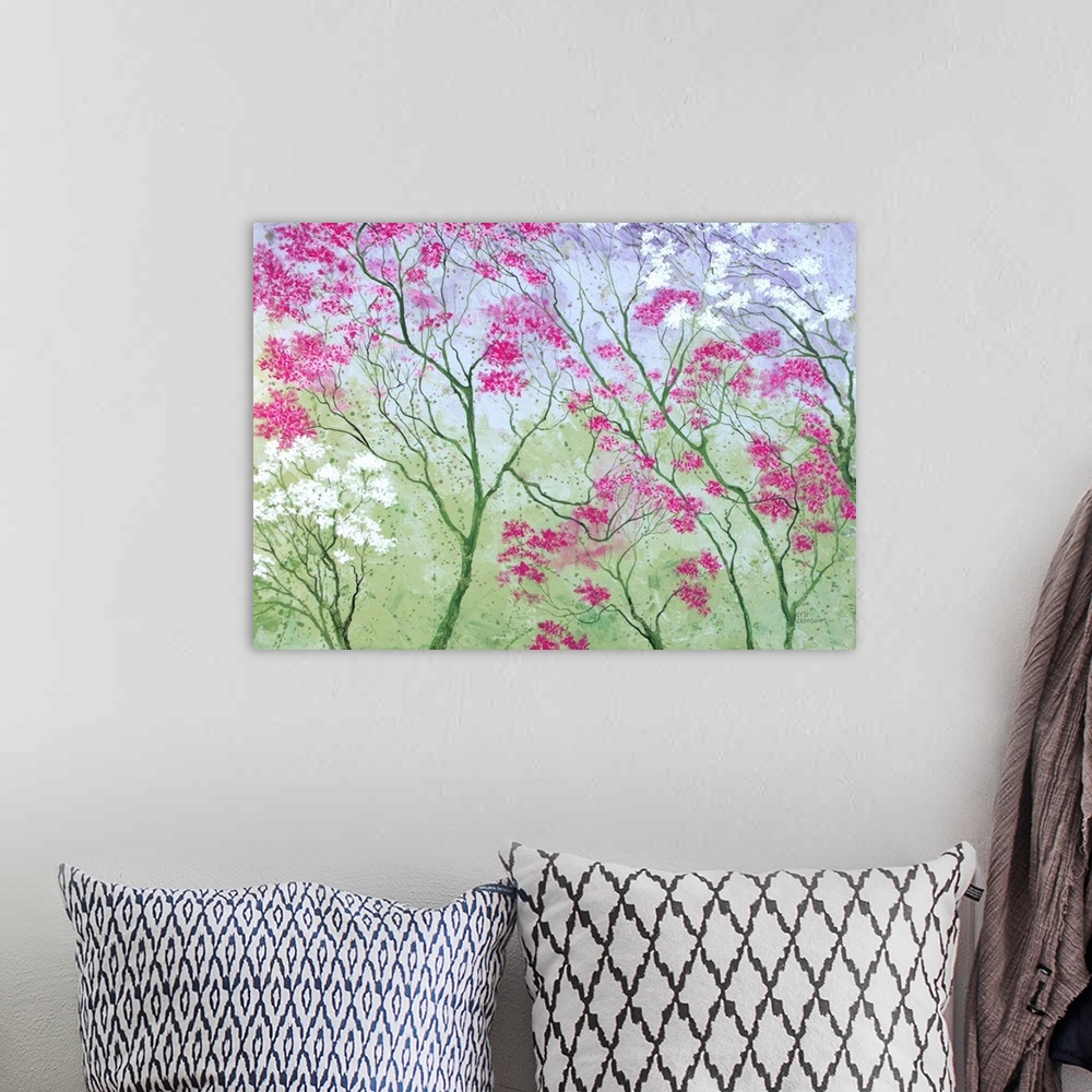 A bohemian room featuring Colorful painting of tree tops with pink, purple, and white blossoms on a green background.