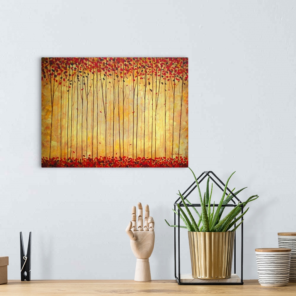 A bohemian room featuring Contemporary painting of a forest with warm hues, tall, thin trees with red leaves and a golden b...