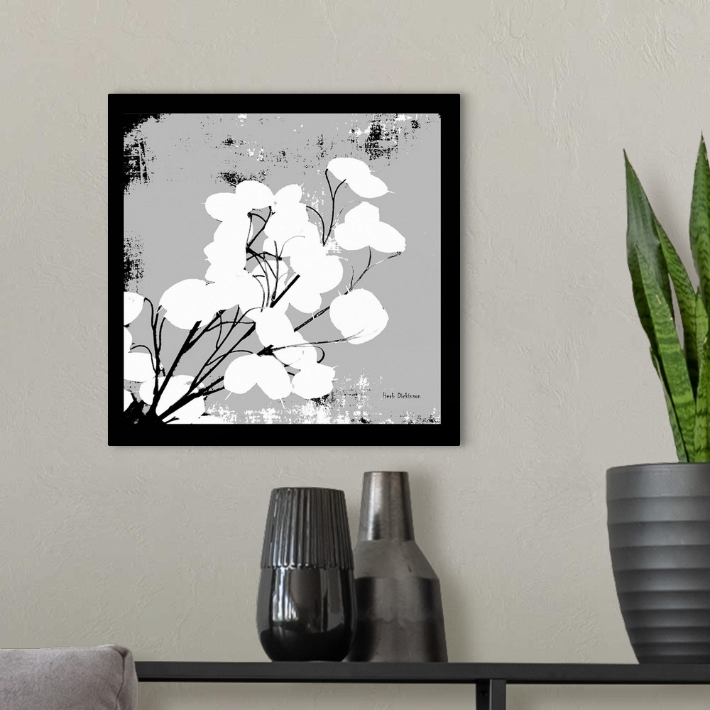 A modern room featuring Square silhouetted painting of a money plant in black, white, and gray.