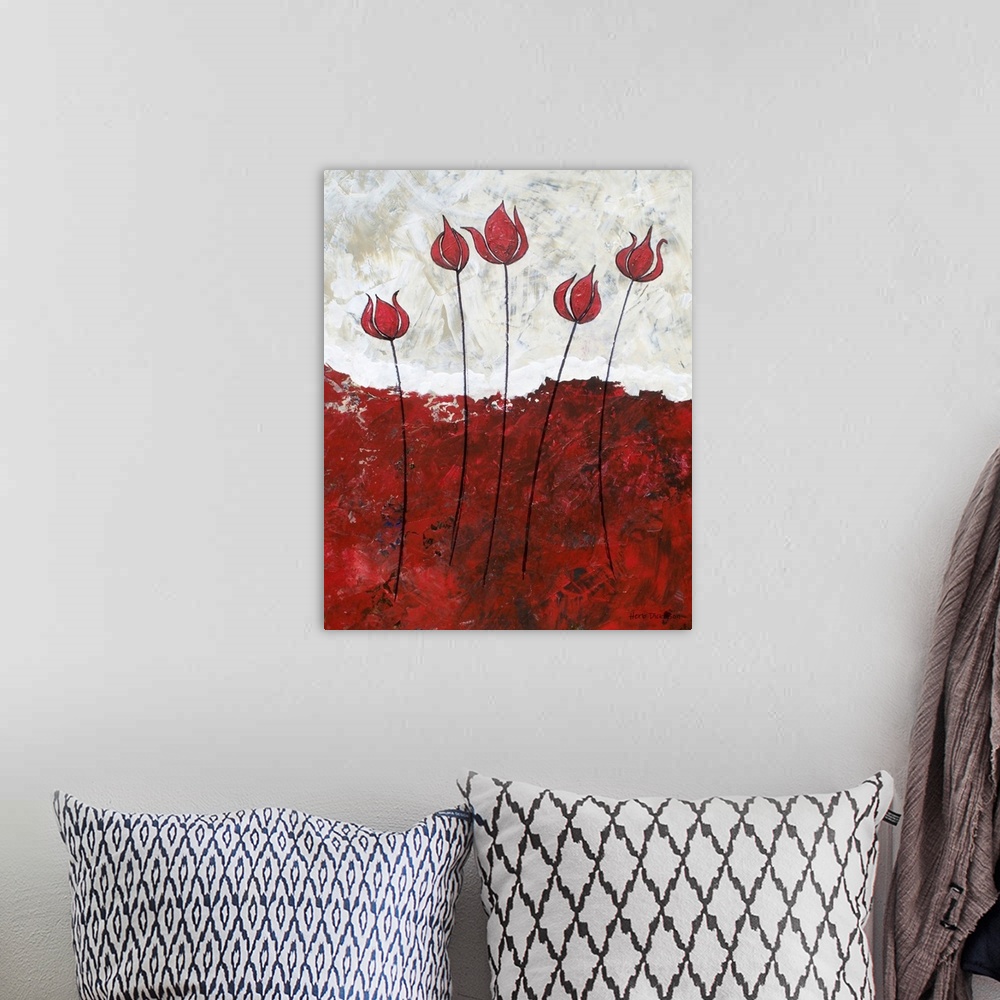 A bohemian room featuring Painting with five long stemmed red flowers with a bold red ground below and a white and beige sk...