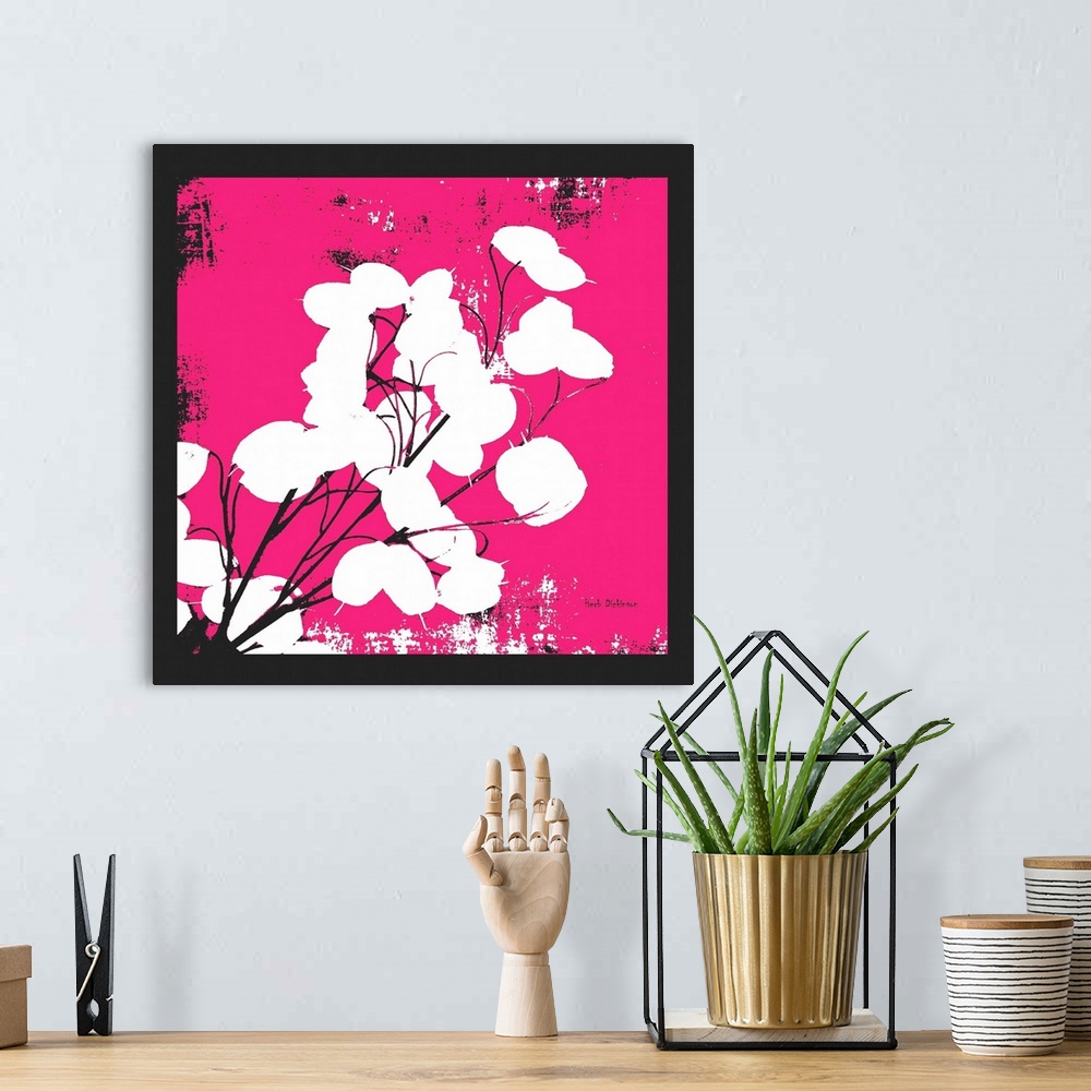 A bohemian room featuring Square silhouetted painting of a money plant in black, white, and pink.