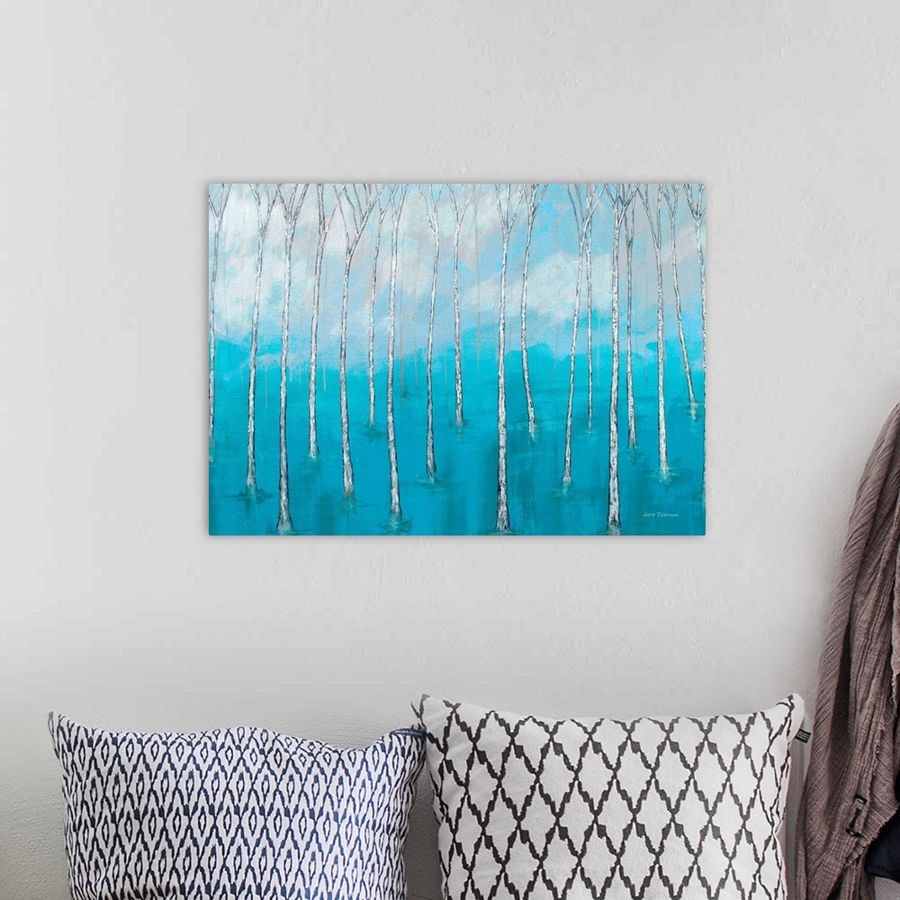 A bohemian room featuring Landscape painting of bare trees in marsh waters with a cloudy background.