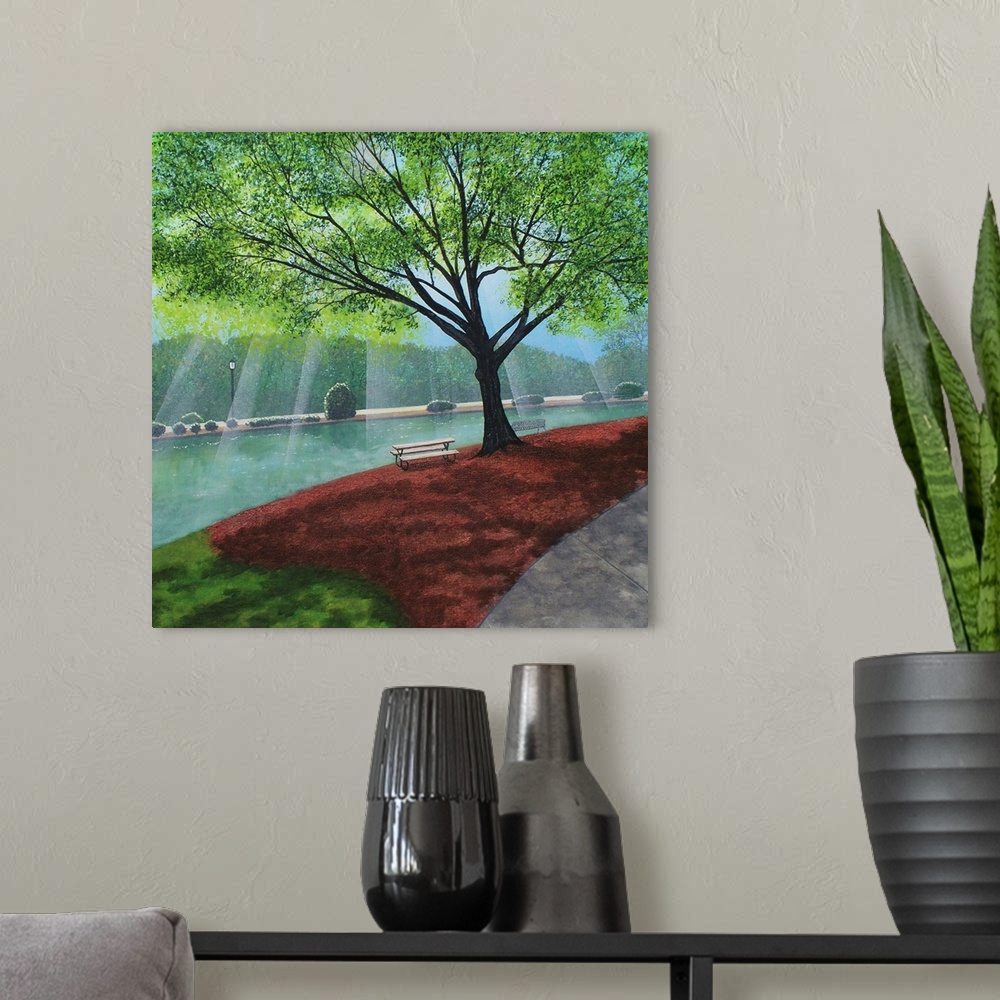 A modern room featuring Freedom Park landscape painting on a square canvas with light beaming onto the water behind the t...