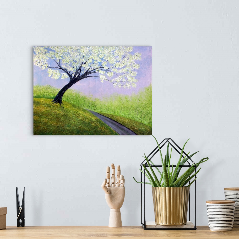 A bohemian room featuring Contemporary painting of a path going up a hillside with a large tree with white blossoms.