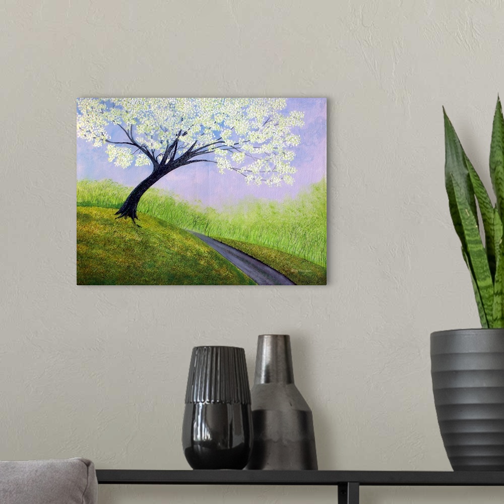 A modern room featuring Contemporary painting of a path going up a hillside with a large tree with white blossoms.