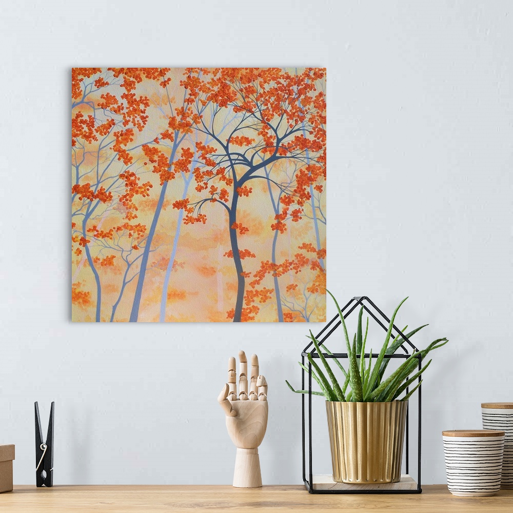 A bohemian room featuring Square painting of orange Autumn trees with a light orange background.