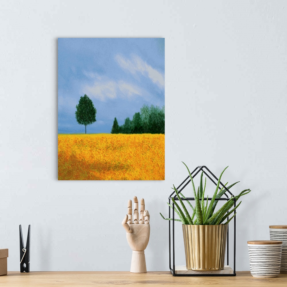 A bohemian room featuring Vertical landscape painting with a golden field in the foreground and trees in the background.
