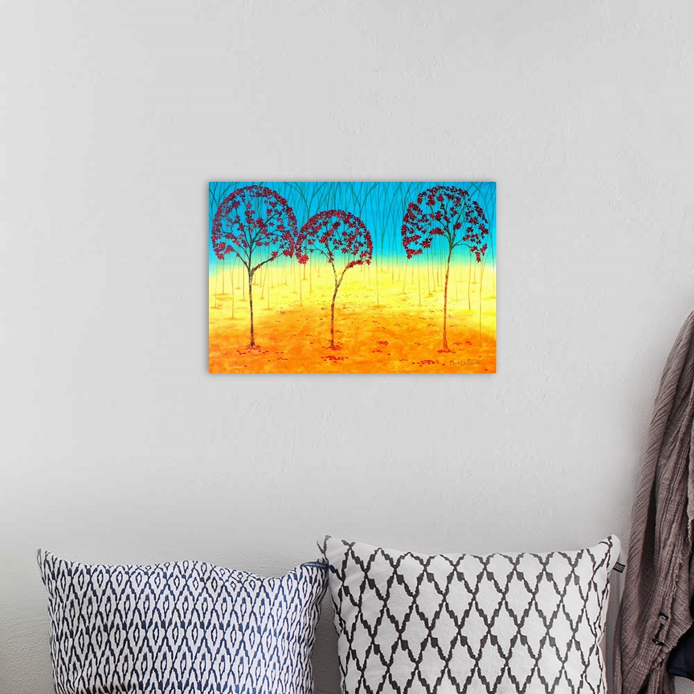 A bohemian room featuring Abstract landscape with red Autumn tree tops and an orange, yellow, and blue background.