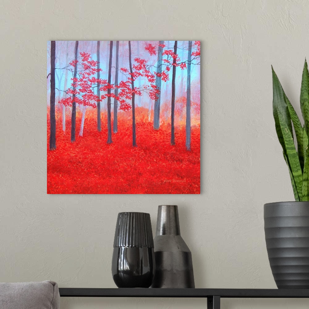 A modern room featuring Impressionist painting of a red Autumn forest with leaves covering the ground.