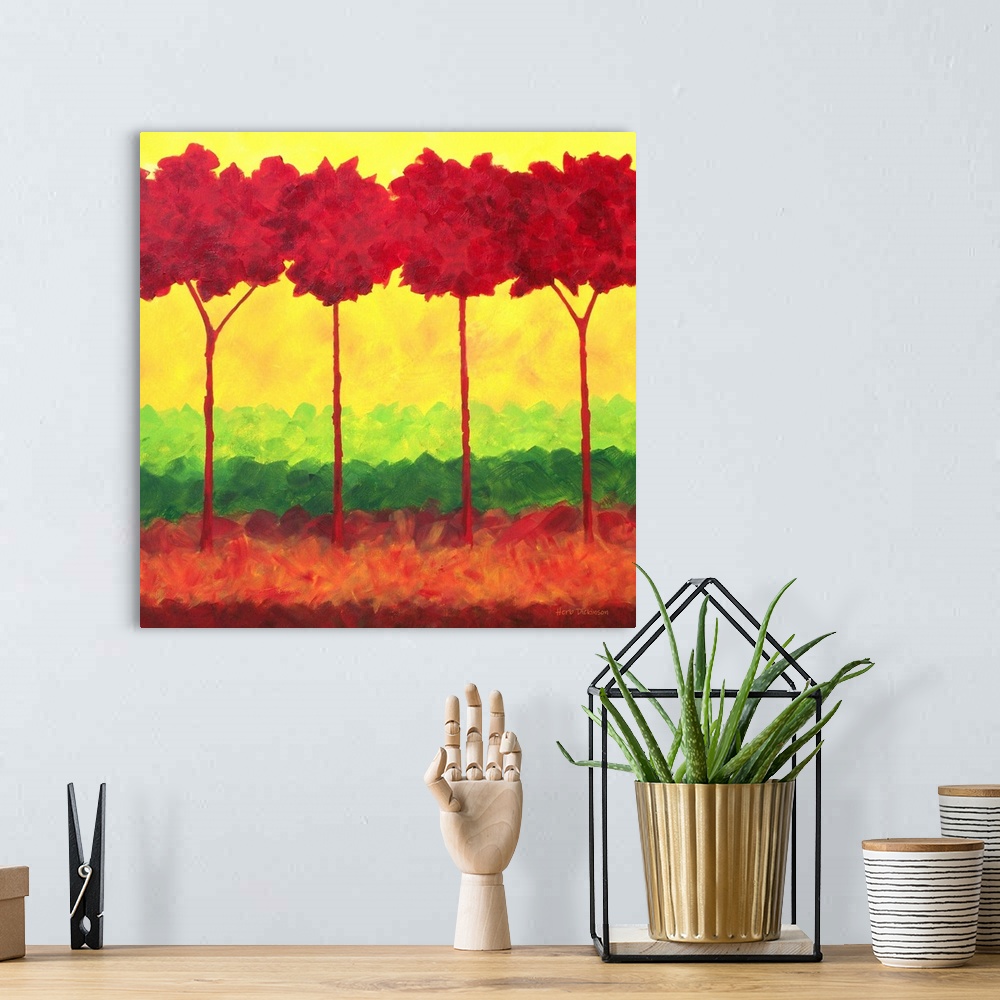 A bohemian room featuring Colorful landscape with bold red trees and a background made with layers of green, red, and yellow.