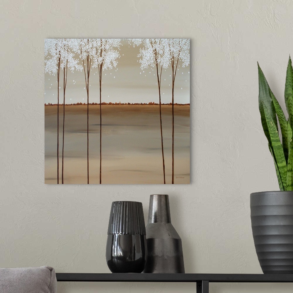 A modern room featuring Minimalist square painting of tall Spring trees with white blossoms.