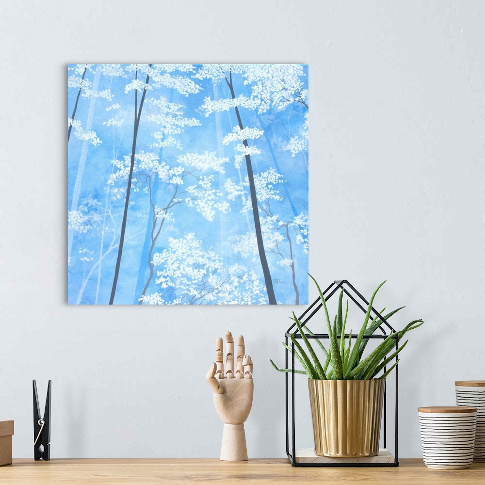 A bohemian room featuring Impressionist painting looking up at white blossomed tree tops with a sky blue background.