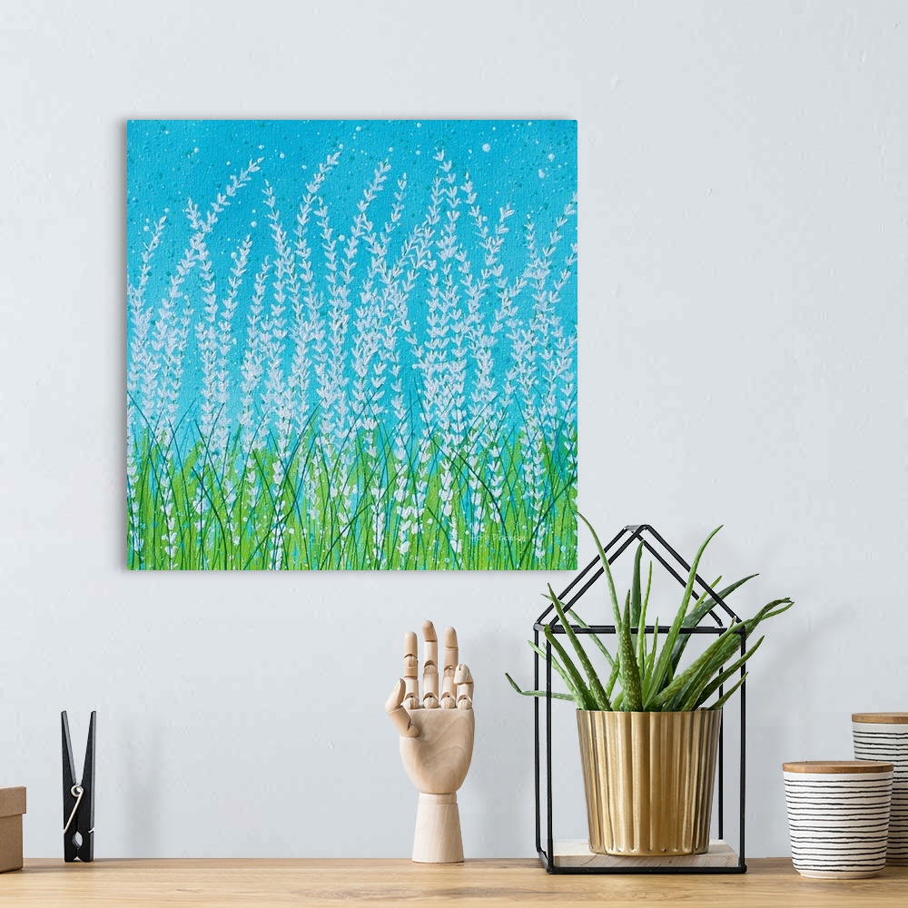 A bohemian room featuring Square painting of a Spring landscape with tall white flowers and green blades of grass on a brig...