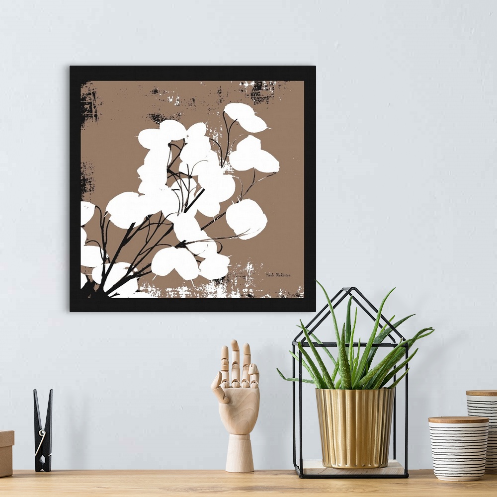 A bohemian room featuring Square silhouetted painting of a money plant in black, white, and brown.