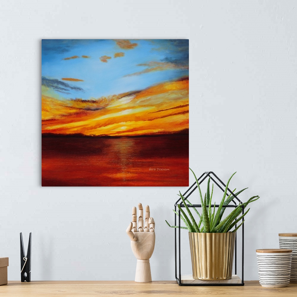 A bohemian room featuring Abstract landscape painting with a bold red, orange, and yellow sunset.