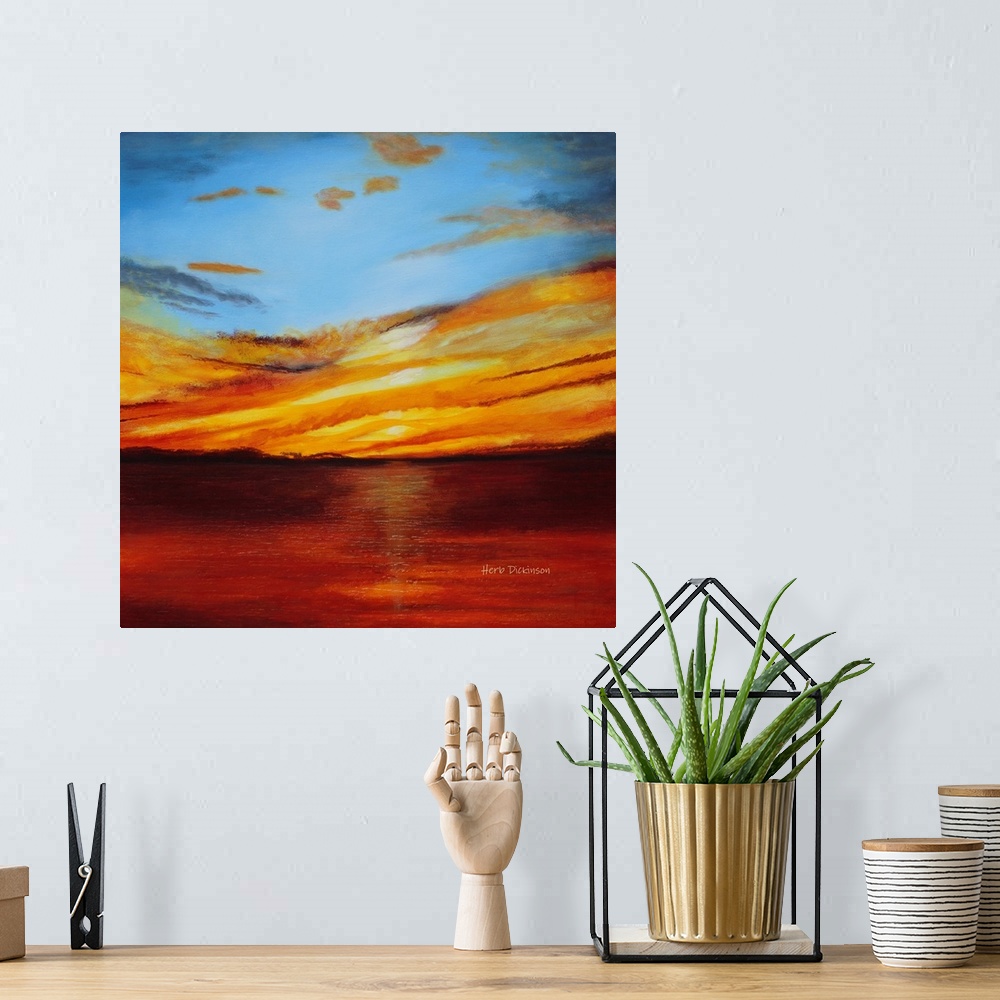 A bohemian room featuring Abstract landscape painting with a bold red, orange, and yellow sunset.