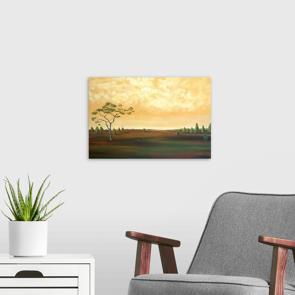 A modern room featuring Contemporary landscape painting of a countryside with a few trees and a golden sky.
