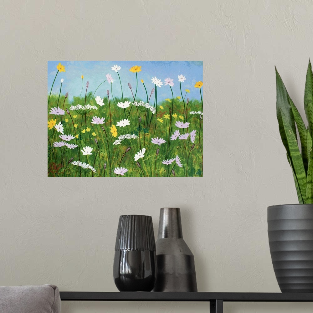 A modern room featuring Contemporary painting of wildflowers with a grassy green background and a clear light blue sky.