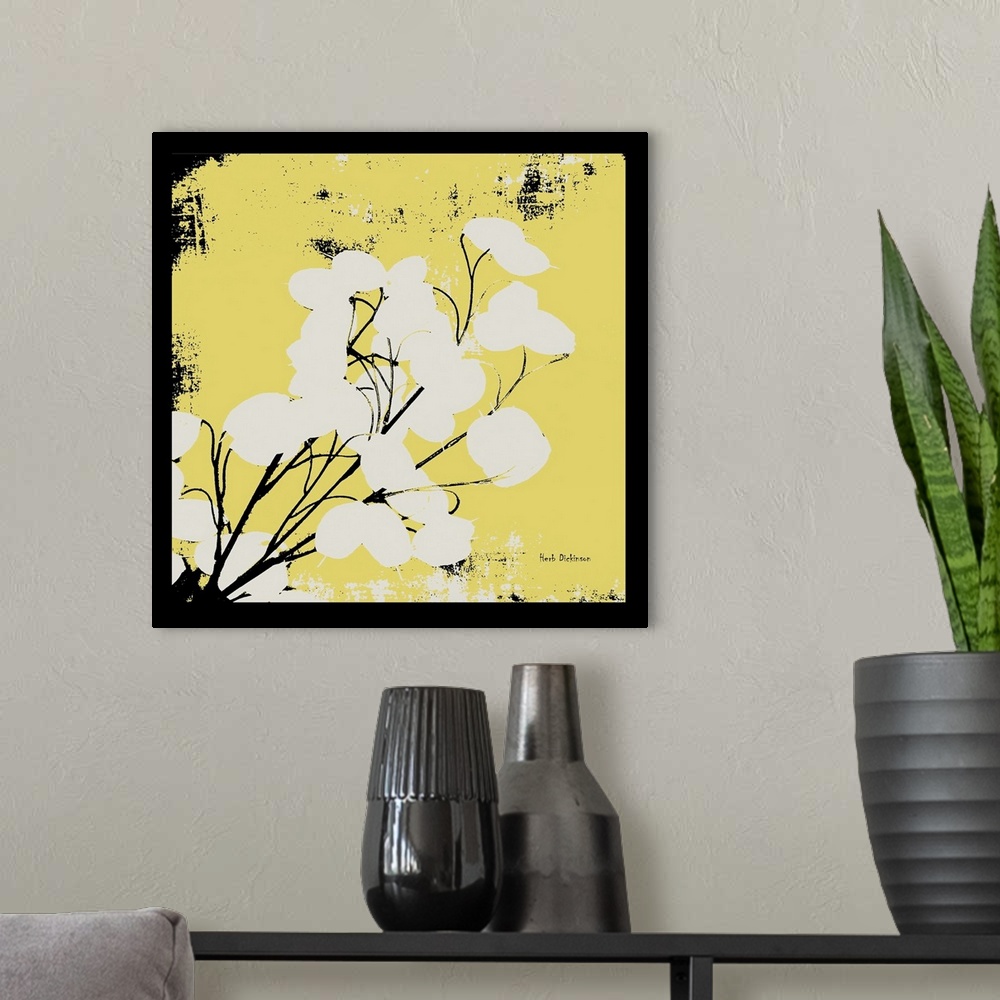 A modern room featuring Square silhouetted painting of a money plant in pale yellow, black, and white with a black boarder.
