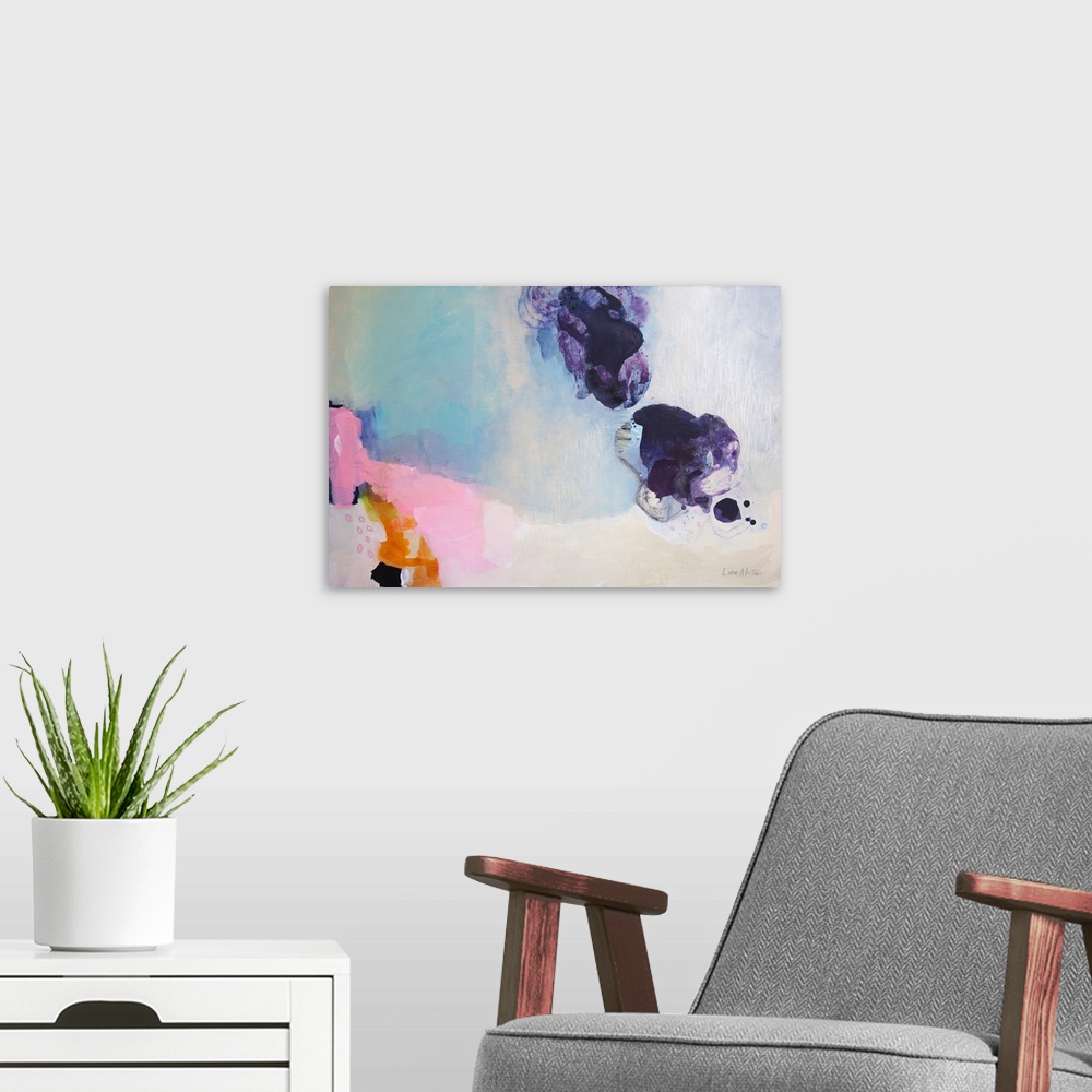 A modern room featuring A horizontal abstract painting with colors of purple, pink and blue.