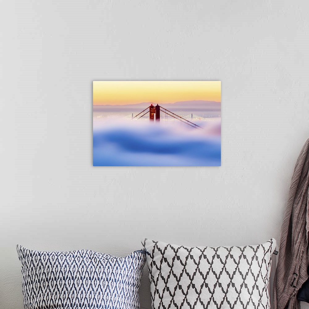 A bohemian room featuring A dynamic photograph of the golden gate bridge just barely making it above a thick blanket of clo...