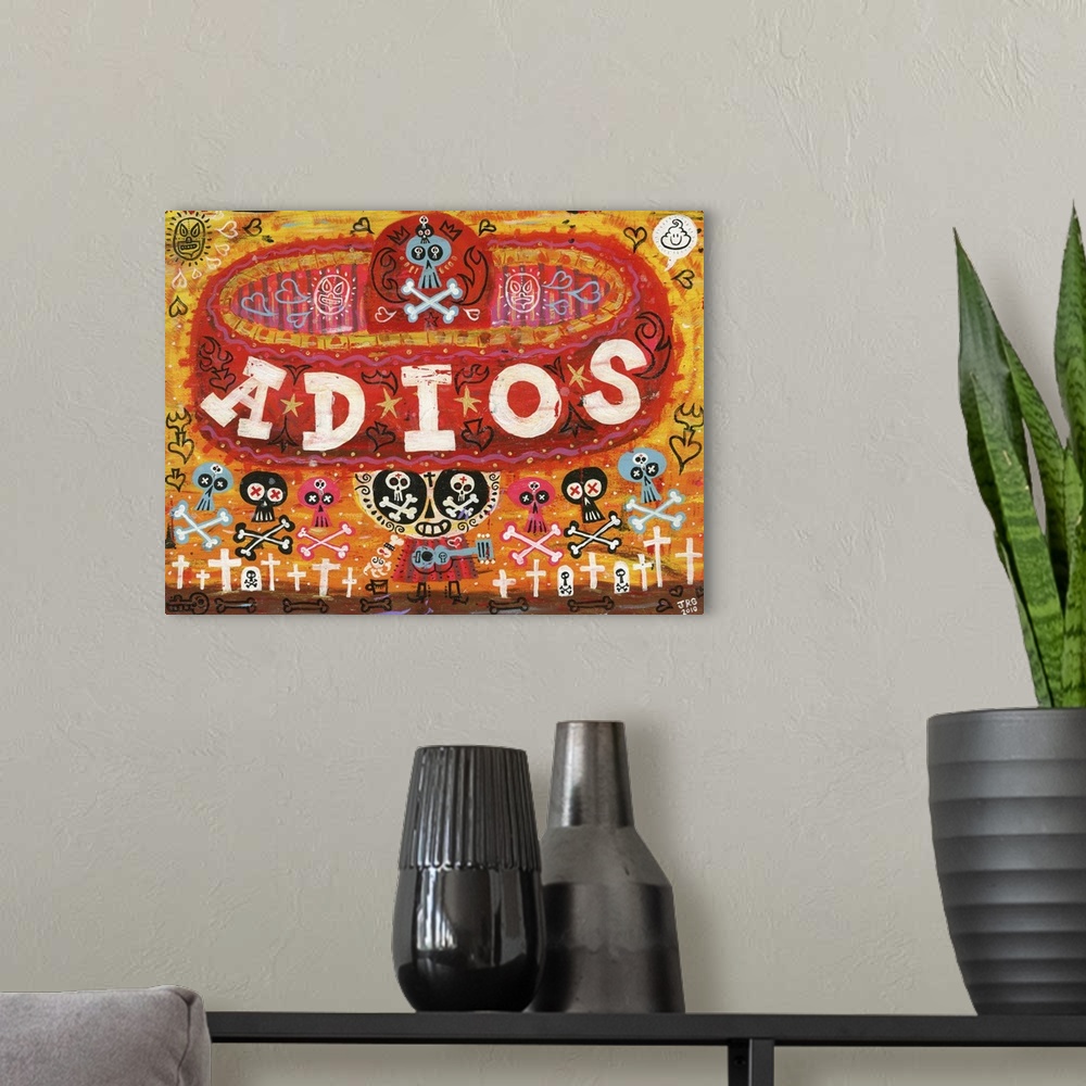 A modern room featuring Latin art of a calavera wearing a large red sombrero with the word "Adios."