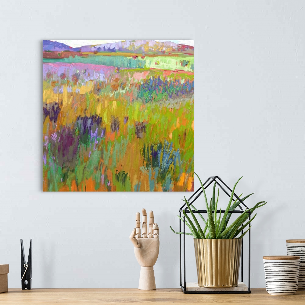 A bohemian room featuring A square abstract of a field with flowers painted with brush strokes of vibrant colors.
